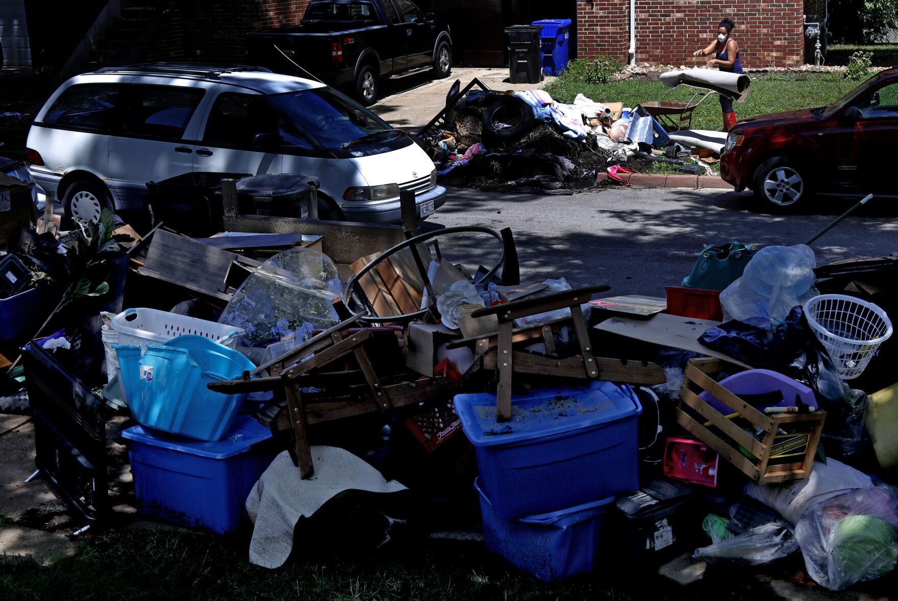 University City residents continue to clean up from flash fooding
